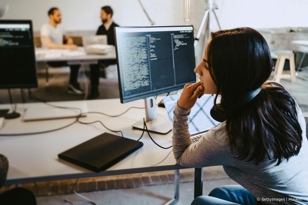 Cybersecurity specialist working at a computer
