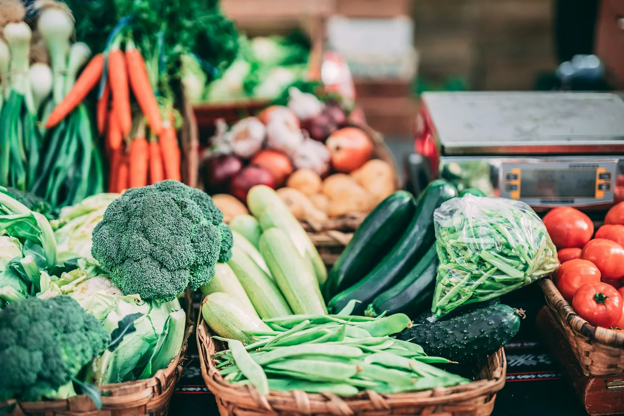 Colourful fresh vegetables displayed at a market.