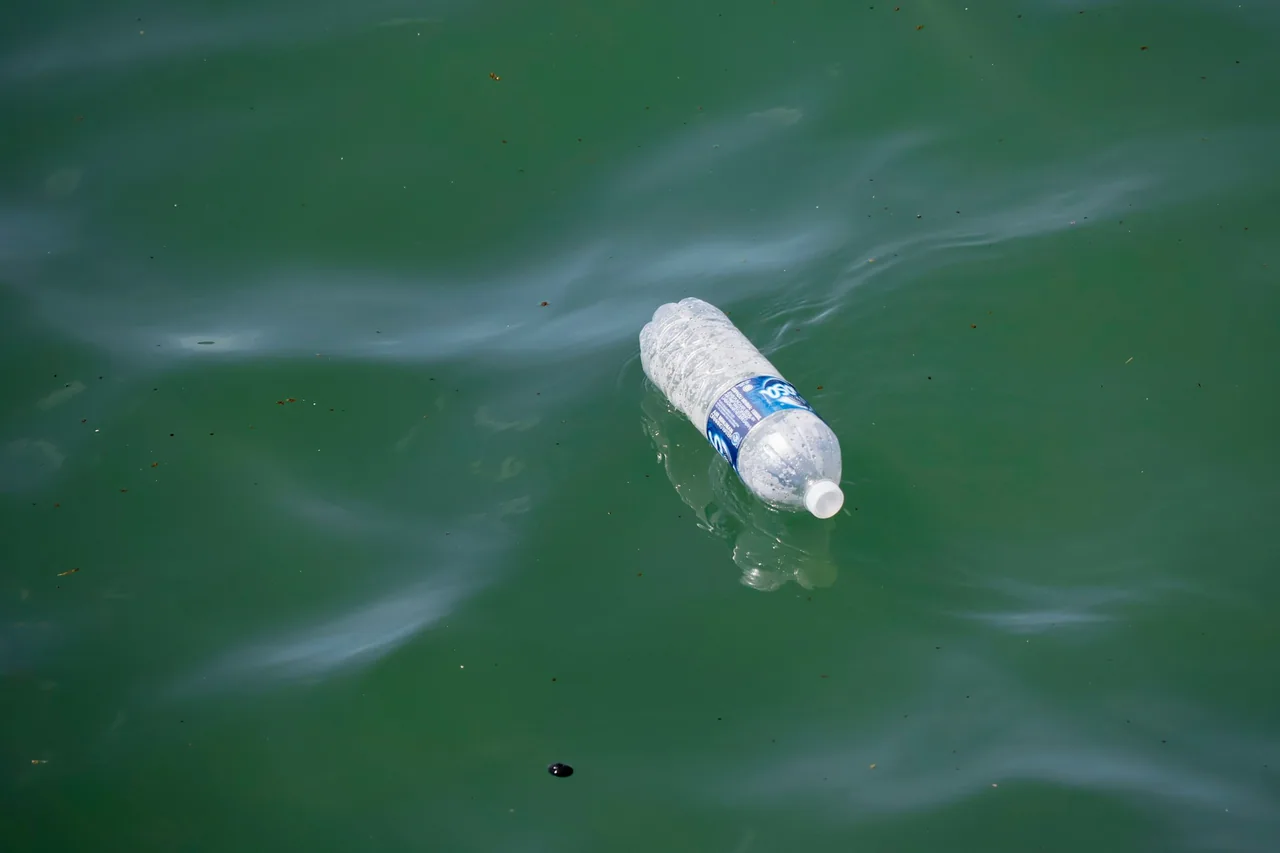 A plastic bottle floating on coastal water in Malaysia.