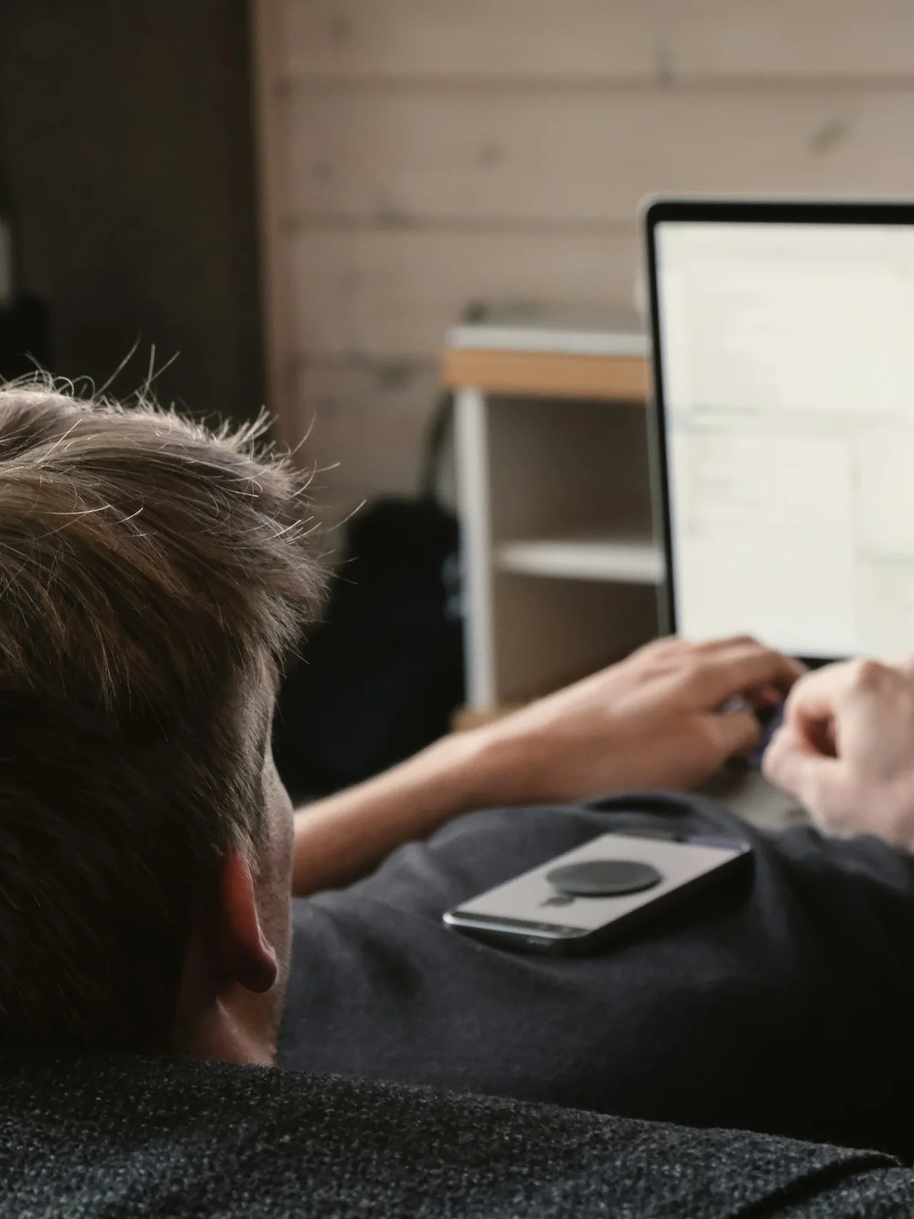 Person working with source code on a laptop